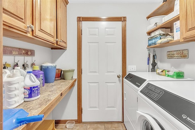 laundry area featuring cabinets, independent washer and dryer, and light tile patterned flooring