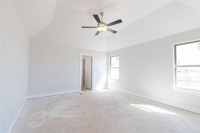 spare room with lofted ceiling, baseboards, and ceiling fan