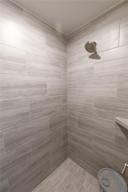 bathroom with tiled shower