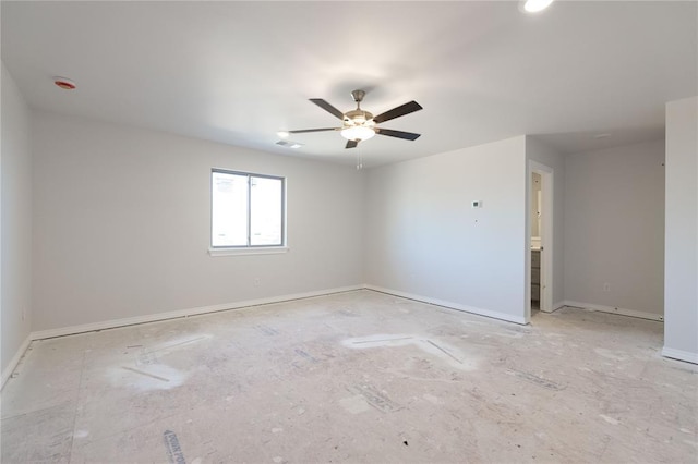 unfurnished room featuring visible vents, a ceiling fan, and baseboards