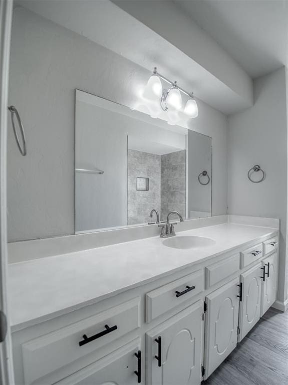 bathroom featuring wood-type flooring and vanity