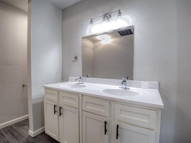 bathroom featuring hardwood / wood-style floors and vanity