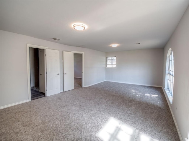 unfurnished room with carpet flooring