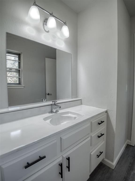 bathroom featuring hardwood / wood-style floors and vanity