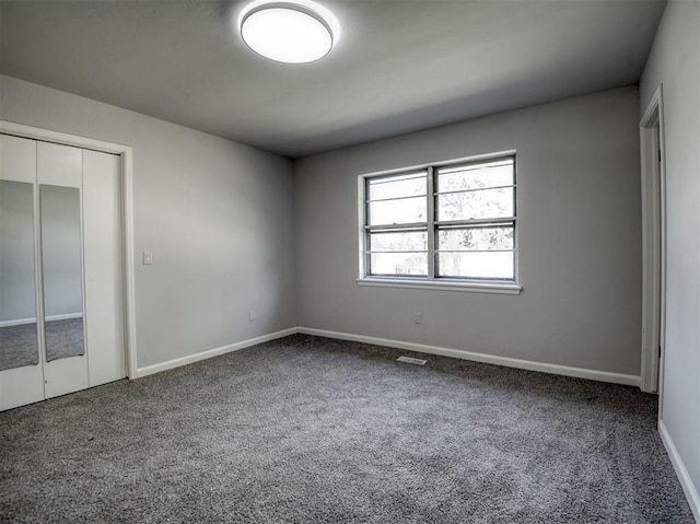 unfurnished bedroom with carpet floors