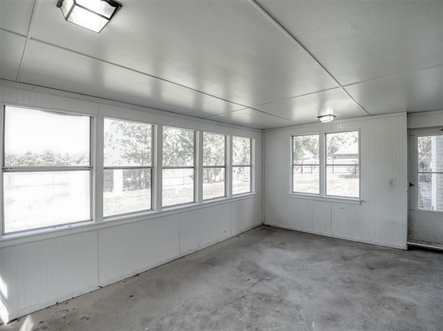 unfurnished sunroom featuring a healthy amount of sunlight