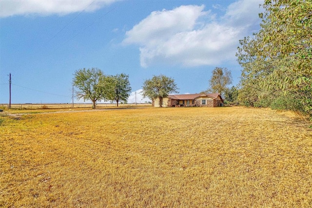 view of yard with a rural view