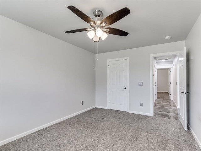 unfurnished bedroom with carpet flooring and ceiling fan