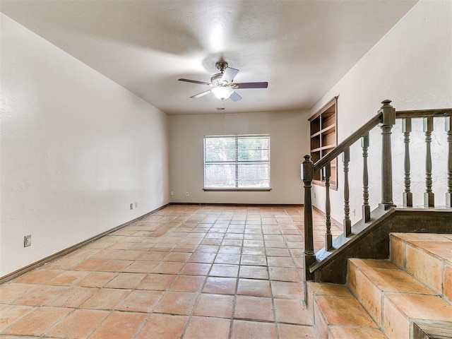 interior space with ceiling fan