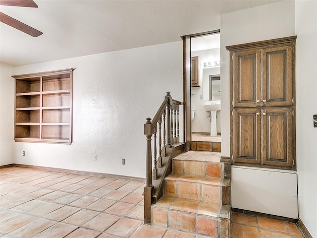 stairs with ceiling fan