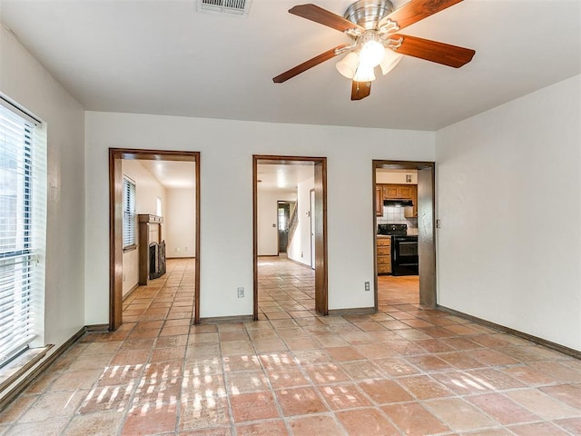 unfurnished room with ceiling fan