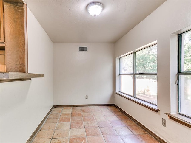 view of tiled spare room