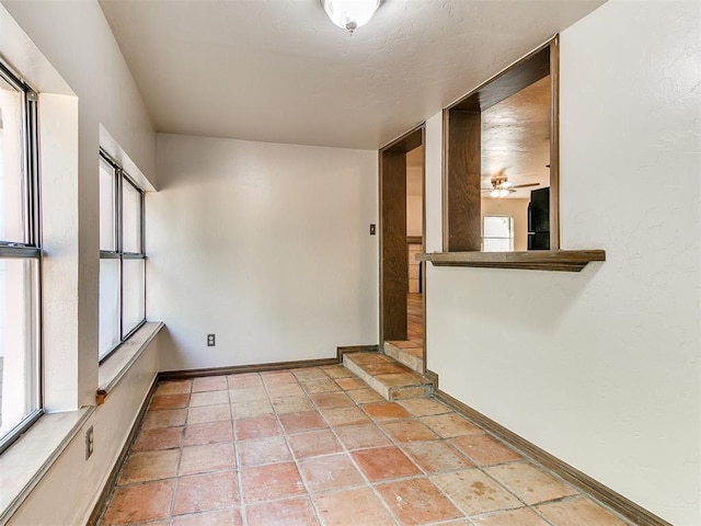 spare room featuring ceiling fan