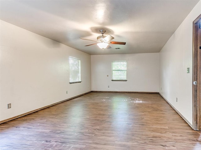 unfurnished room featuring ceiling fan and light hardwood / wood-style flooring