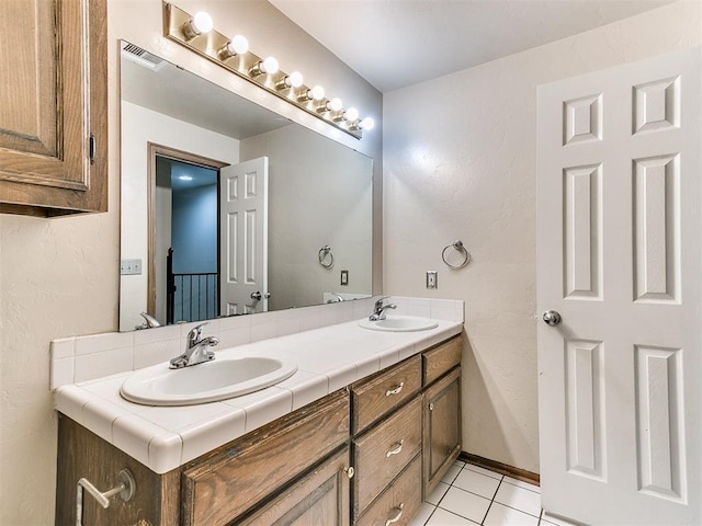 bathroom featuring tile patterned floors and vanity