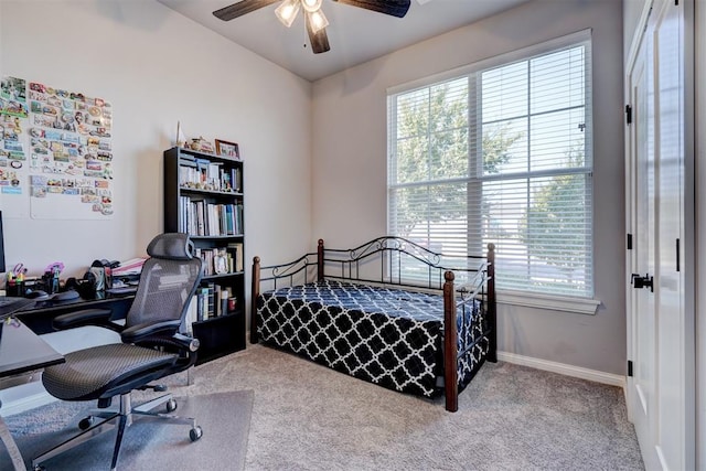 bedroom with ceiling fan and light colored carpet