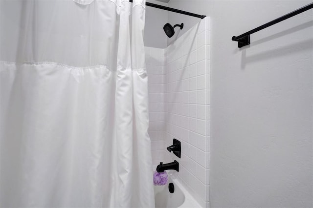 bathroom with shower / tub combo with curtain