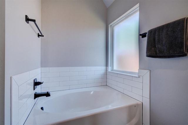 bathroom featuring a tub to relax in