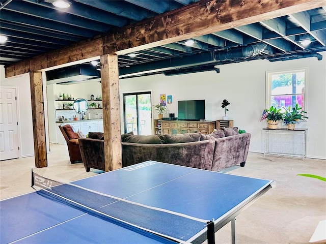 playroom featuring concrete flooring and sink