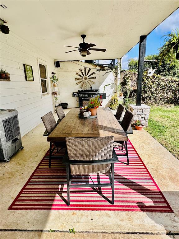 view of patio / terrace featuring ceiling fan and a grill