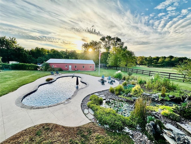 view of home's community featuring a yard and a rural view