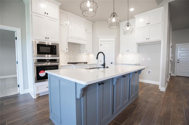 9309 Cheek Ranch Rd, Yukon, OK 73099 - kitchen with baseboards, a sink, stainless steel oven, and white cabinets