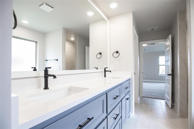 9309 Cheek Ranch Rd, Yukon, OK 73099 - bathroom with a sink, tile patterned floors, double vanity, and visible vents