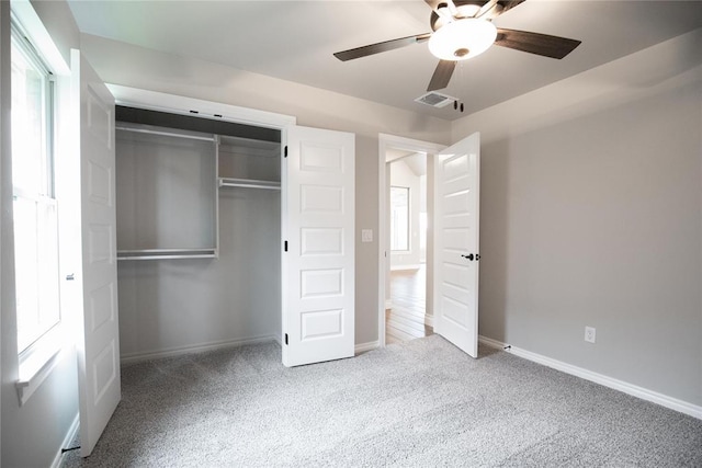 9309 Cheek Ranch Rd, Yukon, OK 73099 - unfurnished bedroom with visible vents, a closet, baseboards, ceiling fan, and carpet flooring