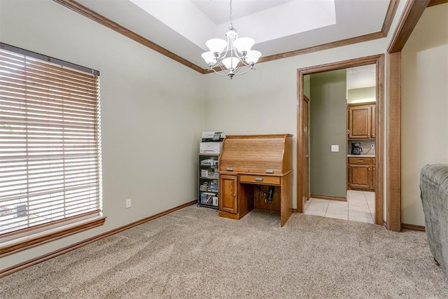 carpeted office space with ornamental molding, a tray ceiling, and a chandelier