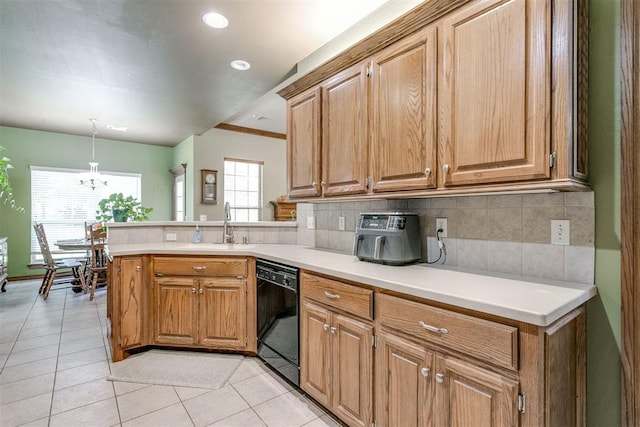 kitchen with kitchen peninsula, sink, black dishwasher, hanging light fixtures, and light tile patterned flooring