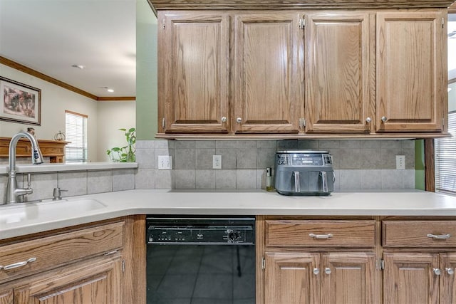 kitchen featuring dishwasher, decorative backsplash, sink, and ornamental molding