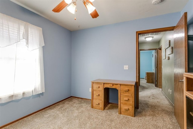 home office featuring light colored carpet and ceiling fan