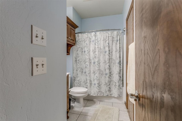 full bathroom featuring tile patterned floors, vanity, shower / bath combination with curtain, and toilet