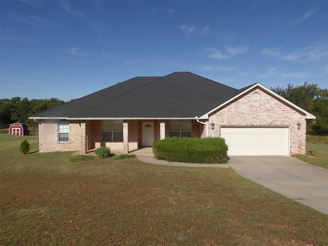 ranch-style house featuring a front yard and a garage