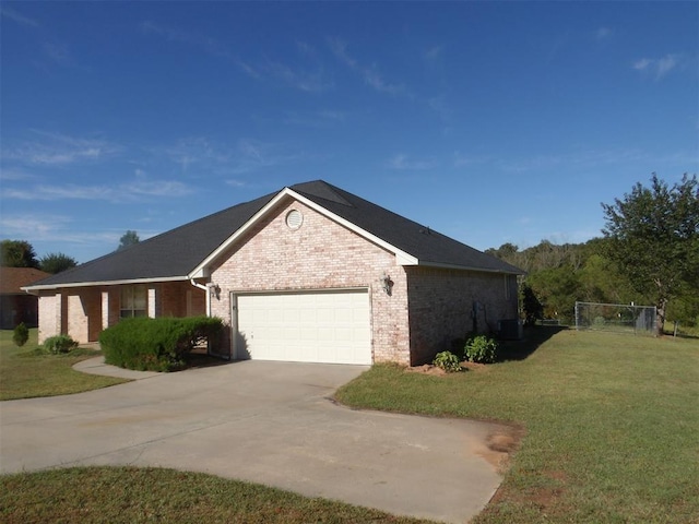 view of home's exterior with a lawn, central AC, and a garage