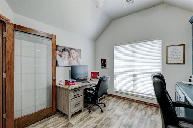 home office with light wood-type flooring, vaulted ceiling, and ceiling fan