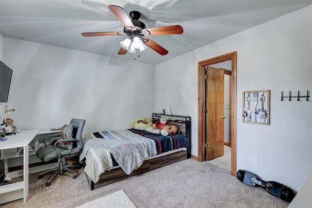 bedroom with light carpet and ceiling fan