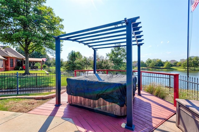 deck with a water view and a pergola