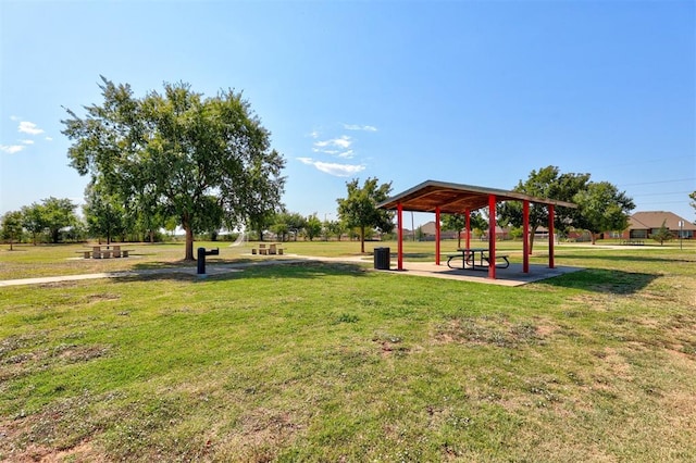 view of property's community with a lawn