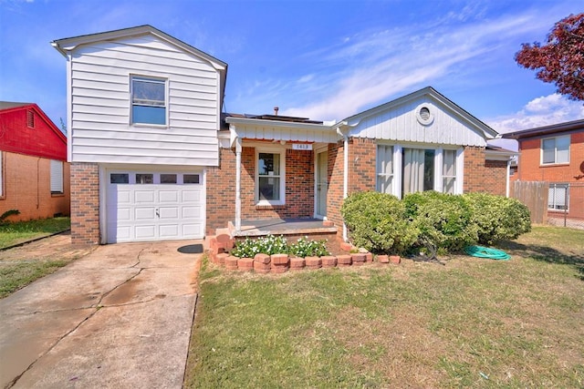 1413 Reding Dr, Oklahoma City, OK 73119 - view of front of house featuring brick siding, a garage, and driveway