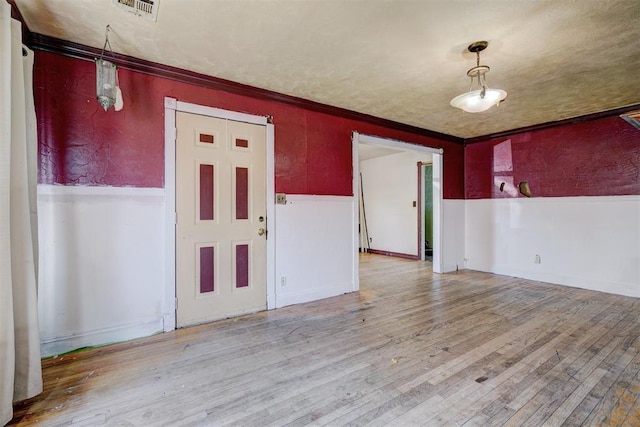 1413 Reding Dr, Oklahoma City, OK 73119 - spare room with a wainscoted wall, wood finished floors, and crown molding