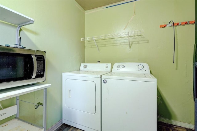1413 Reding Dr, Oklahoma City, OK 73119 - laundry area with washing machine and dryer, wood finished floors, and baseboards