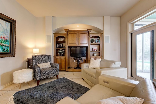 living room with light tile patterned floors