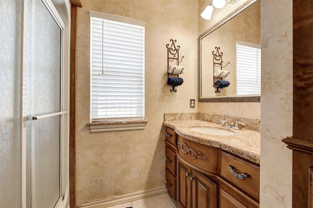 bathroom with tile patterned flooring, vanity, and an enclosed shower