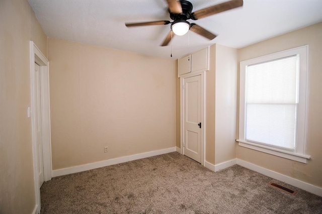 unfurnished bedroom with light colored carpet and ceiling fan