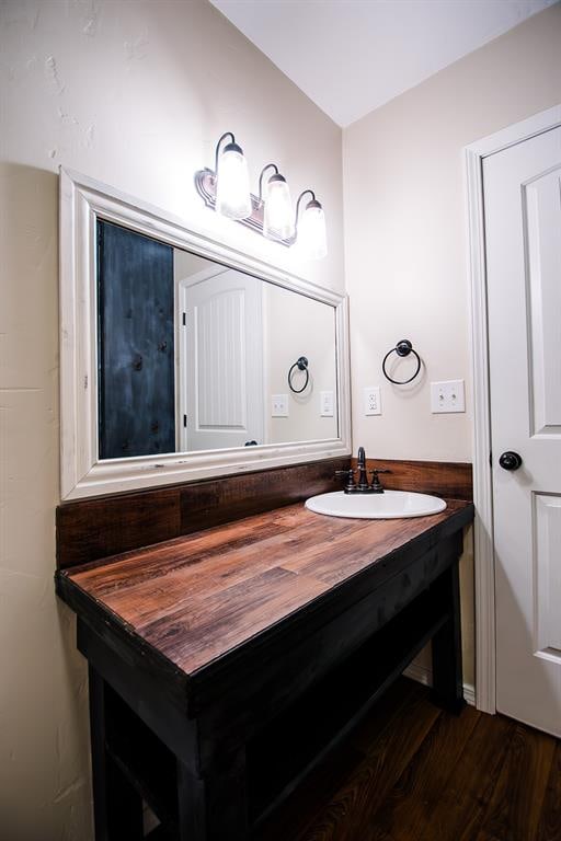 bathroom featuring vanity and hardwood / wood-style flooring