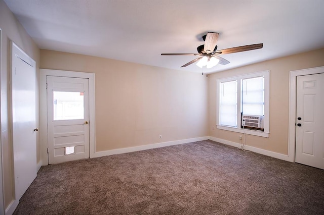 interior space featuring ceiling fan, plenty of natural light, and carpet floors