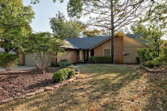 900 Woodbury Dr, Edmond, OK 73034 - ranch-style house featuring a front yard and a garage