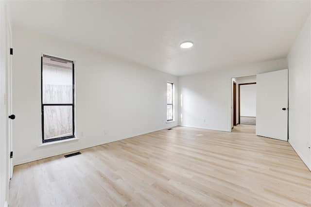 spare room with light wood-type flooring