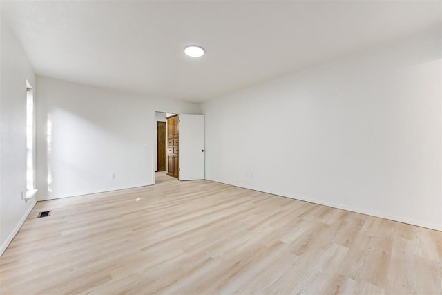 empty room with light wood-type flooring